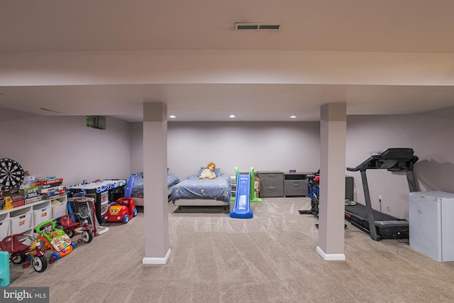 interior space featuring baseboards, carpet flooring, recessed lighting, and visible vents