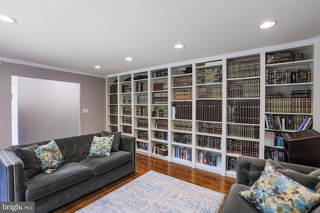 living area featuring crown molding, recessed lighting, and wood finished floors