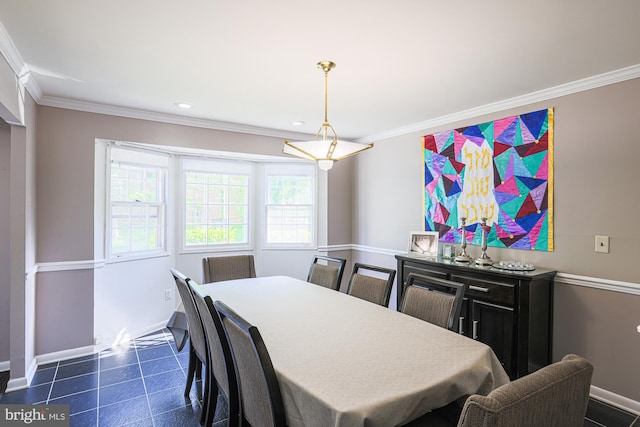dining room featuring crown molding, baseboards, and recessed lighting