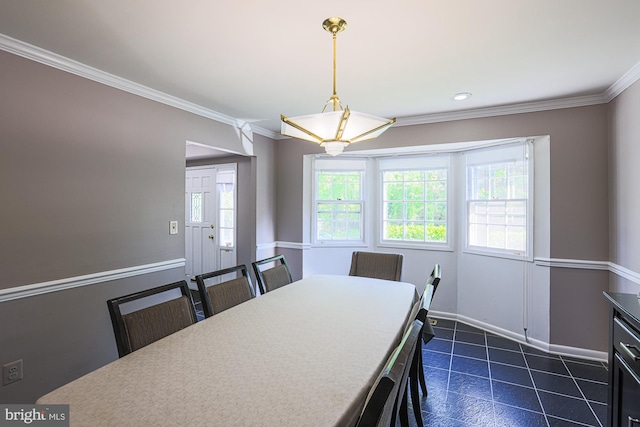 dining room featuring baseboards, ornamental molding, and recessed lighting