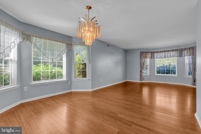 12 Jon Dr, Barnegat, NJ 08005 - unfurnished room with baseboards, a chandelier, visible vents, and wood finished floors