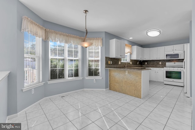 12 Jon Dr, Barnegat, NJ 08005 - kitchen featuring white appliances, hanging light fixtures, a peninsula, decorative backsplash, and white cabinets