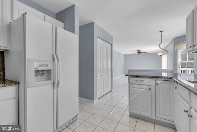12 Jon Dr, Barnegat, NJ 08005 - kitchen featuring white fridge with ice dispenser, dark stone countertops, white cabinets, ceiling fan, and light tile patterned flooring