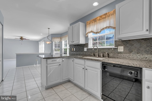 12 Jon Dr, Barnegat, NJ 08005 - kitchen featuring white cabinets, black dishwasher, tasteful backsplash, and a sink