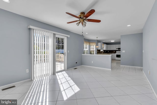 12 Jon Dr, Barnegat, NJ 08005 - unfurnished living room featuring light tile patterned floors, visible vents, baseboards, and ceiling fan