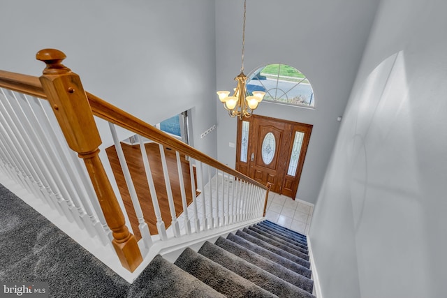 12 Jon Dr, Barnegat, NJ 08005 - entryway featuring stairway, tile patterned floors, a chandelier, and a towering ceiling