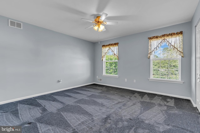 12 Jon Dr, Barnegat, NJ 08005 - spare room with baseboards, a ceiling fan, visible vents, and dark carpet
