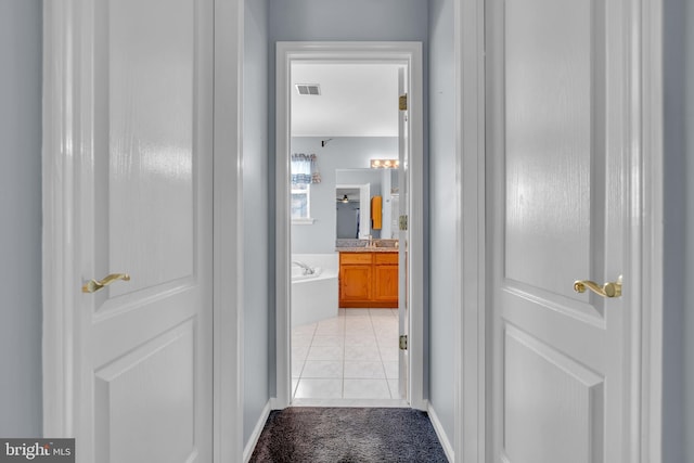 12 Jon Dr, Barnegat, NJ 08005 - corridor with visible vents, baseboards, light tile patterned flooring, and light carpet