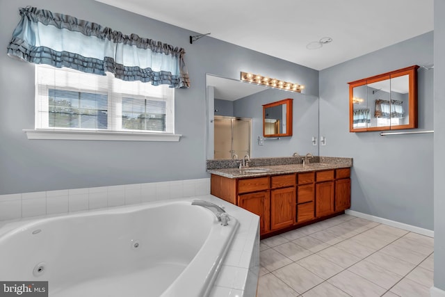 12 Jon Dr, Barnegat, NJ 08005 - bathroom featuring a tub with jets, tile patterned floors, double vanity, and a sink