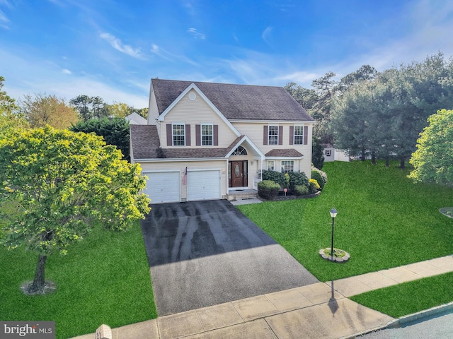 12 Jon Dr, Barnegat, NJ 08005 - traditional home with an attached garage, roof with shingles, driveway, and a front yard