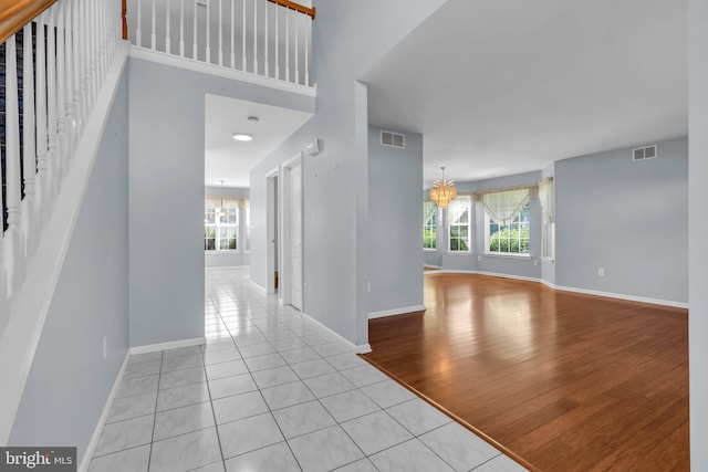 12 Jon Dr, Barnegat, NJ 08005 - foyer entrance featuring an inviting chandelier, visible vents, and a healthy amount of sunlight