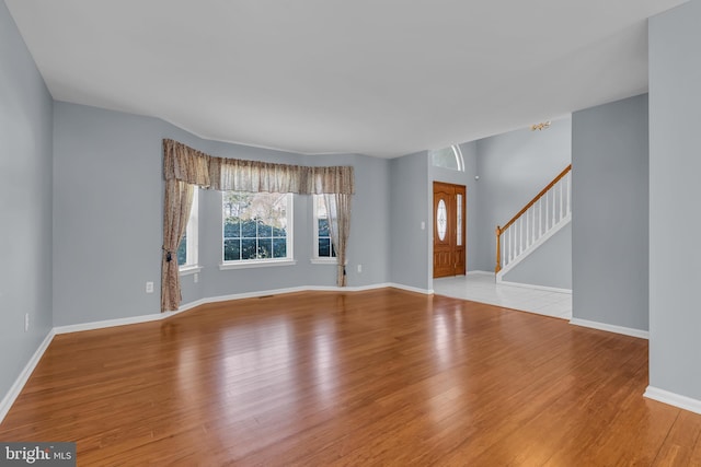12 Jon Dr, Barnegat, NJ 08005 - unfurnished living room with stairs, baseboards, and wood finished floors