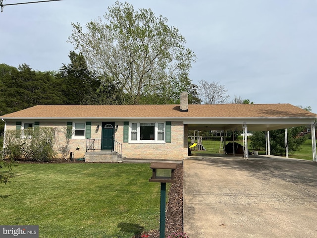 ranch-style home with a front lawn, driveway, a chimney, and a carport
