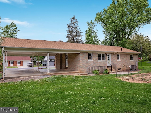 850 Virginia Cir, Strasburg, VA 22657 - back of house featuring central air condition unit, a lawn, brick siding, and a carport