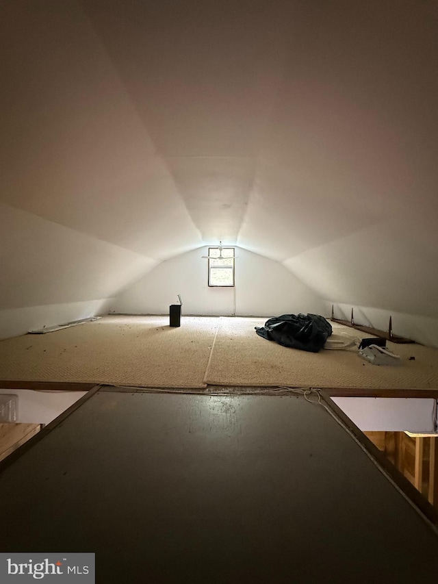 bonus room featuring vaulted ceiling