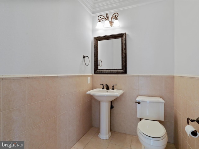 191 Inez Ln, Stephens City, VA 22655 - half bathroom with a wainscoted wall, ornamental molding, toilet, and tile walls