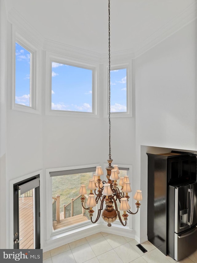 191 Inez Ln, Stephens City, VA 22655 - details featuring visible vents, crown molding, stainless steel fridge with ice dispenser, baseboards, and a notable chandelier