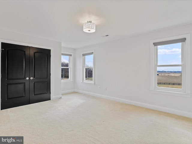 191 Inez Ln, Stephens City, VA 22655 - unfurnished bedroom featuring visible vents, carpet, baseboards, and multiple windows