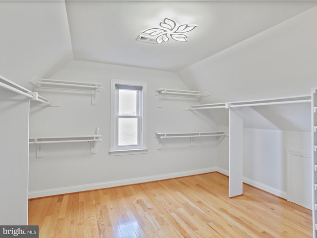 191 Inez Ln, Stephens City, VA 22655 - walk in closet featuring visible vents, vaulted ceiling, and hardwood / wood-style flooring