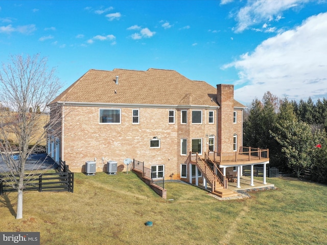 191 Inez Ln, Stephens City, VA 22655 - rear view of property featuring a deck, brick siding, central air condition unit, a yard, and stairway