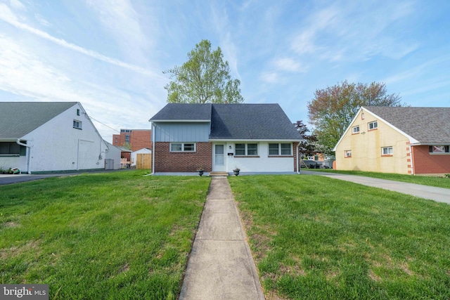 1504 Montgomery Rd, Wilmington, DE 19805 - view of front facade with brick siding and a front yard