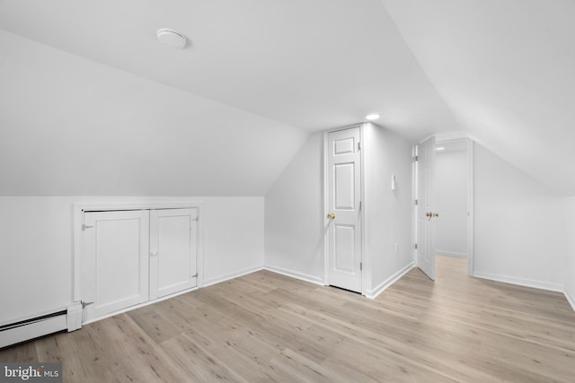 1504 Montgomery Rd, Wilmington, DE 19805 - bonus room with a baseboard heating unit, light wood-style floors, baseboards, and lofted ceiling