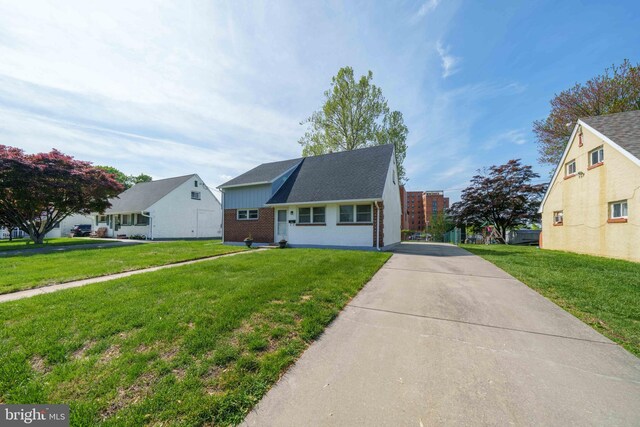 1504 Montgomery Rd, Wilmington, DE 19805 - view of front of property featuring brick siding, a front lawn, and driveway