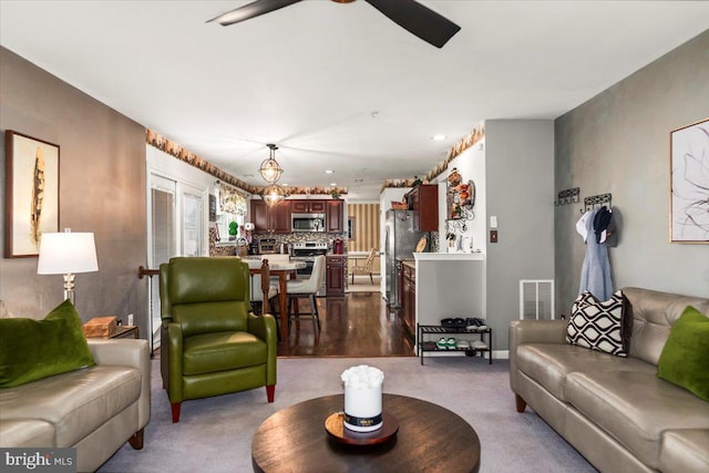 living room featuring visible vents, recessed lighting, ceiling fan, and dark carpet