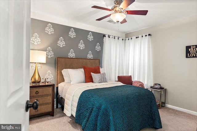 bedroom featuring carpet flooring, baseboards, and ceiling fan