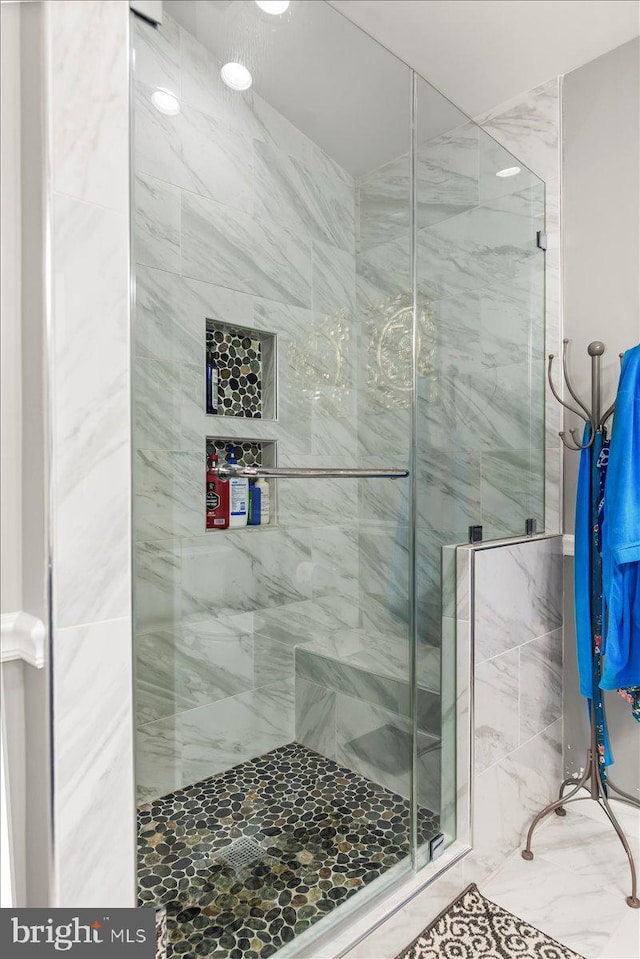 full bath featuring a shower stall