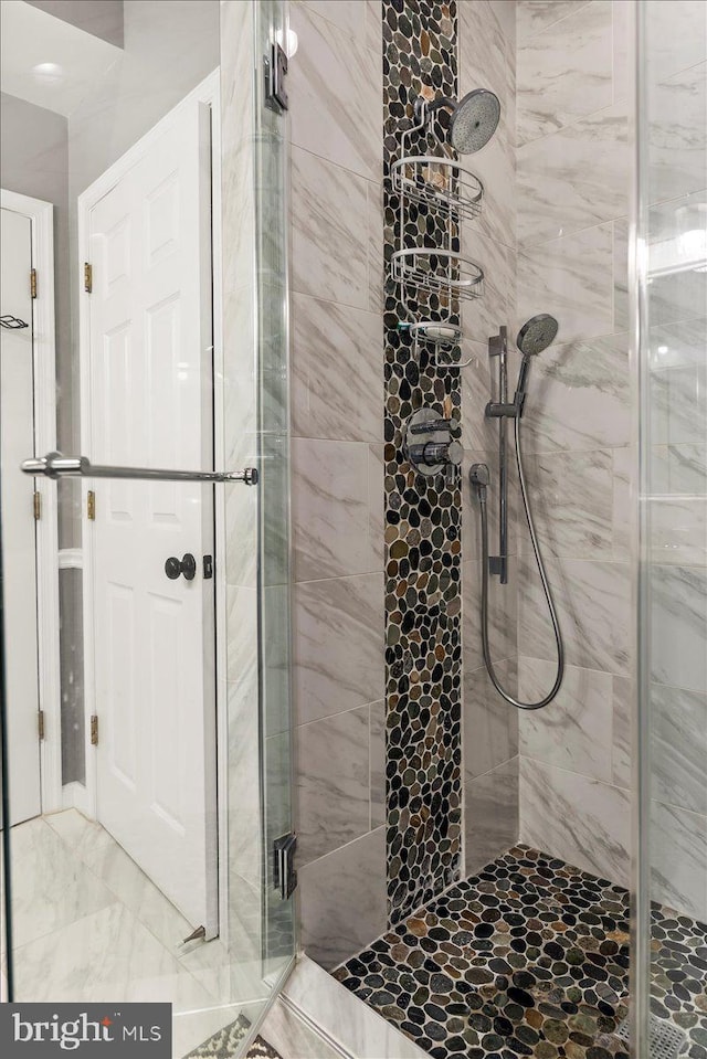 full bath with a shower stall
