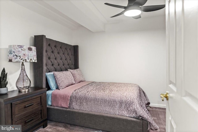 carpeted bedroom featuring baseboards and a ceiling fan