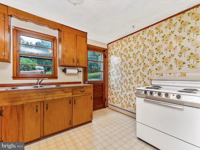 9618 Hall Rd, Frederick, MD 21701 - kitchen featuring white electric range oven, wallpapered walls, a sink, baseboard heating, and healthy amount of natural light