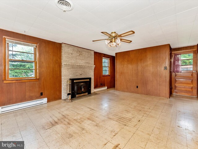 9618 Hall Rd, Frederick, MD 21701 - unfurnished living room with a baseboard heating unit, a baseboard radiator, wooden walls, tile patterned floors, and ceiling fan