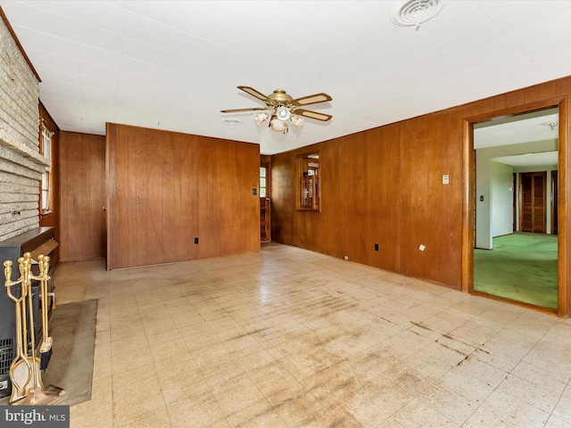 9618 Hall Rd, Frederick, MD 21701 - unfurnished living room featuring tile patterned floors, wooden walls, and ceiling fan