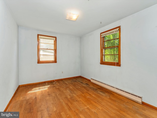 9618 Hall Rd, Frederick, MD 21701 - unfurnished room featuring a baseboard heating unit, wood finished floors, and baseboards