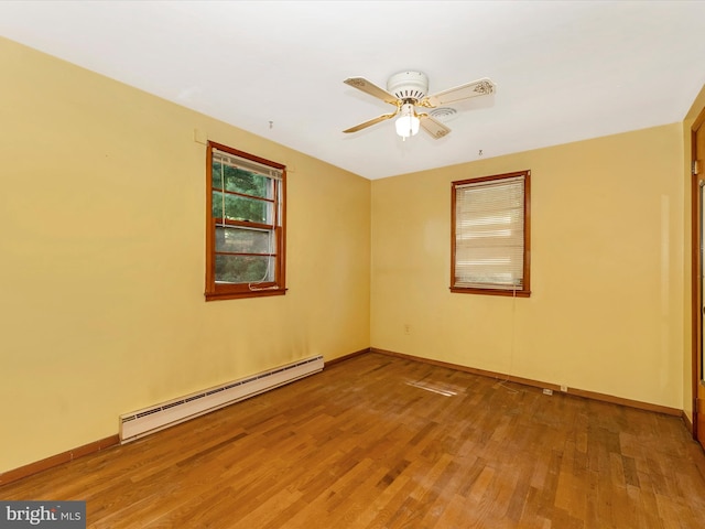 9618 Hall Rd, Frederick, MD 21701 - unfurnished room featuring baseboard heating, wood finished floors, baseboards, and ceiling fan