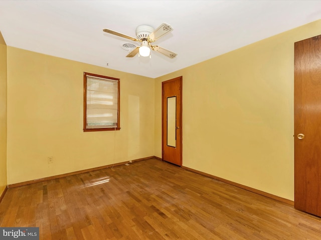9618 Hall Rd, Frederick, MD 21701 - empty room with wood finished floors, ceiling fan, and baseboards