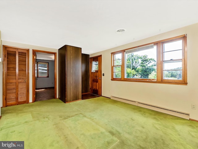 9618 Hall Rd, Frederick, MD 21701 - carpeted foyer with a baseboard heating unit