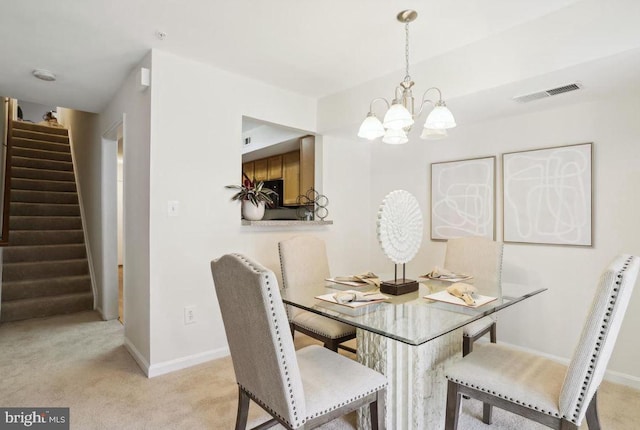 dining space with visible vents, baseboards, stairway, carpet, and a notable chandelier