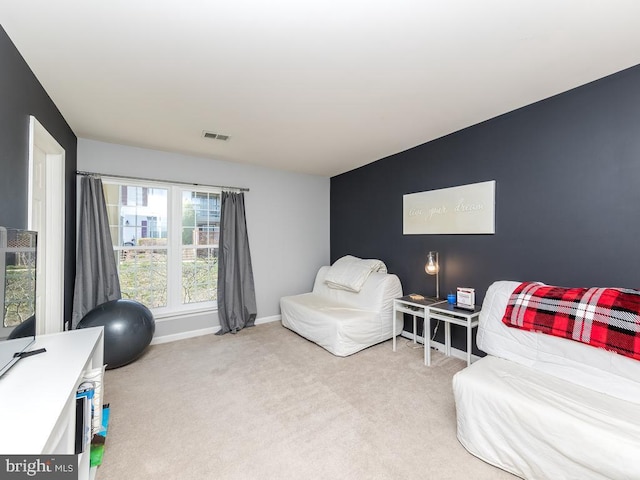 interior space with visible vents, baseboards, and carpet floors