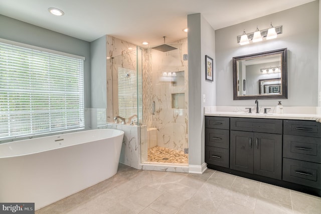 7140 Barry Rd, Alexandria, VA 22315 - full bathroom with a marble finish shower, vanity, a soaking tub, and recessed lighting