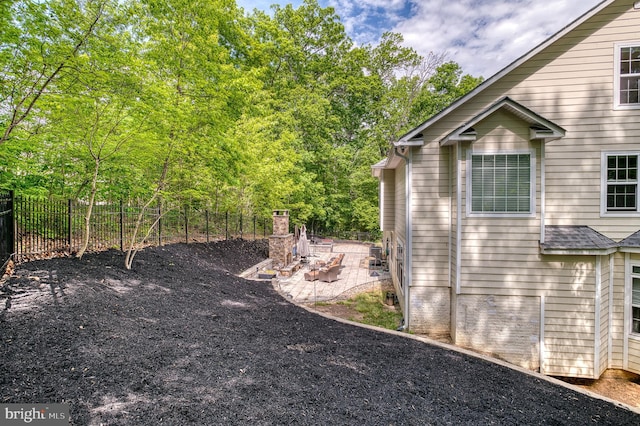 7140 Barry Rd, Alexandria, VA 22315 - view of side of home featuring a patio and fence