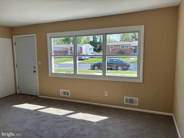 9016 Samoset Rd, Randallstown, MD 21133 - interior space featuring carpet flooring, visible vents, and a healthy amount of sunlight