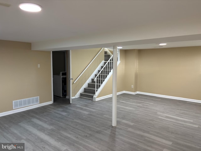 9016 Samoset Rd, Randallstown, MD 21133 - finished below grade area featuring stairway, baseboards, wood finished floors, and visible vents