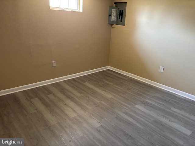 9016 Samoset Rd, Randallstown, MD 21133 - below grade area with baseboards, dark wood-type flooring, and electric panel
