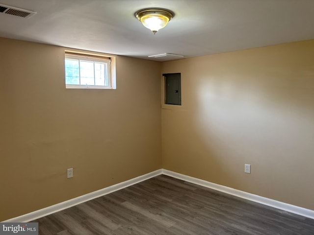 9016 Samoset Rd, Randallstown, MD 21133 - basement with baseboards, visible vents, dark wood-type flooring, and electric panel