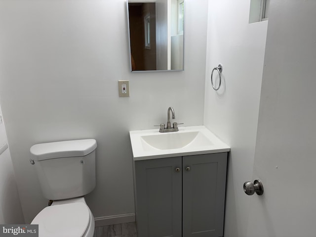 9016 Samoset Rd, Randallstown, MD 21133 - half bath with toilet, baseboards, and vanity