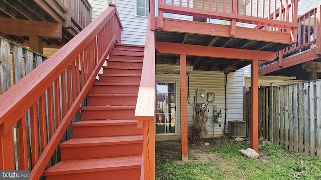exterior space featuring cooling unit and stairs