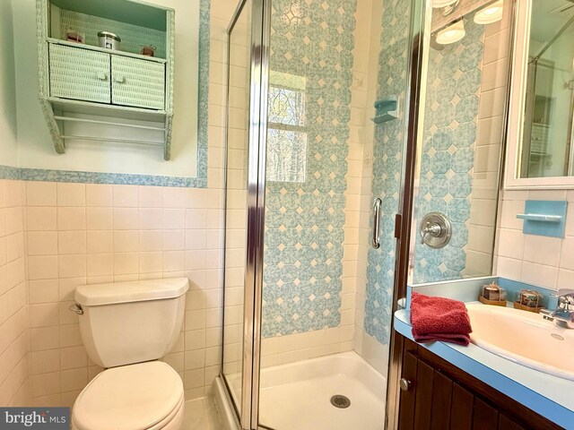 265 Asbury Rd, Egg Harbor Township, NJ 08234 - full bath featuring vanity, a shower stall, toilet, and tile walls